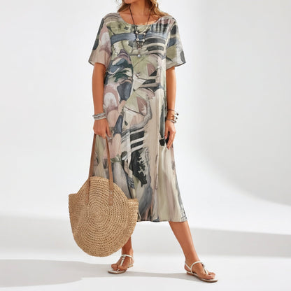 Abito lungo fluido con stampa artistico — Eleganza boho estivo