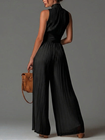 Jumpsuit senza maniche di collo a V nero con cerniera e plissettato di gambe larghe in chiffon